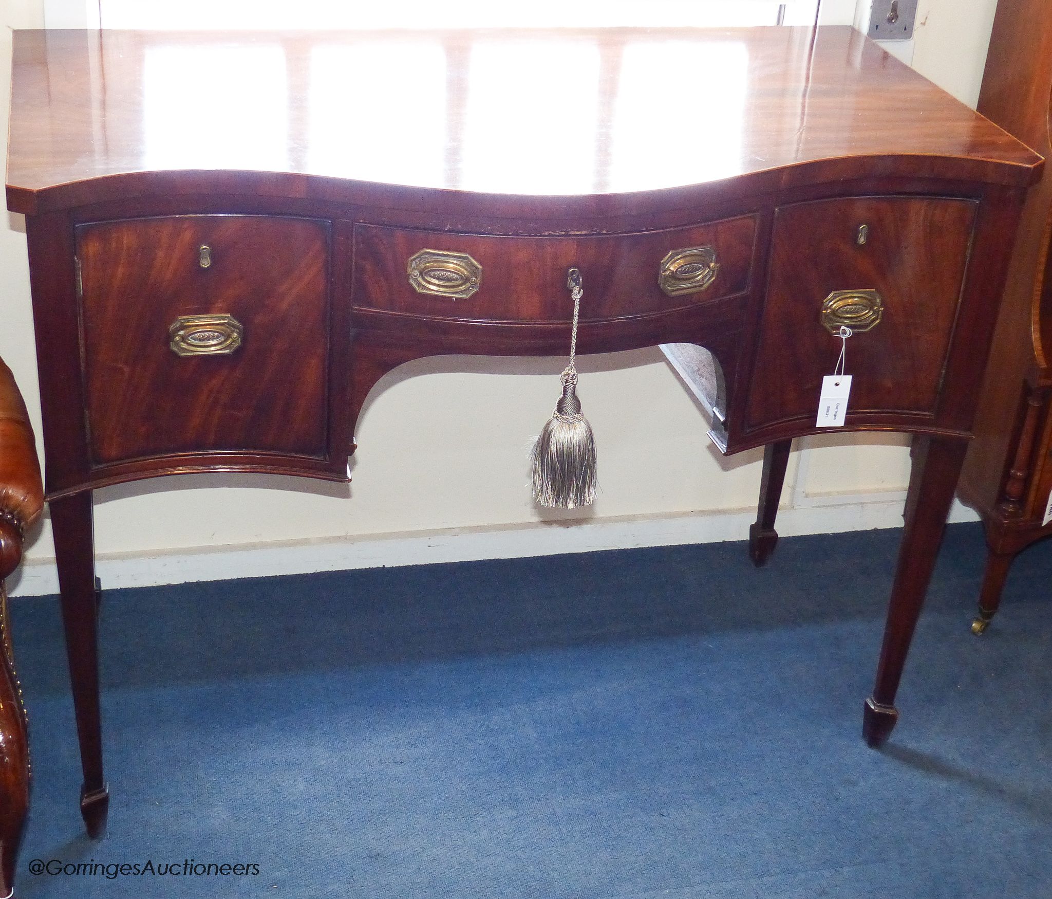 A George III and later mahogany serpentine fronted sideboard, 114.5 cm long, 61 cm deep, 87.5 cm high
